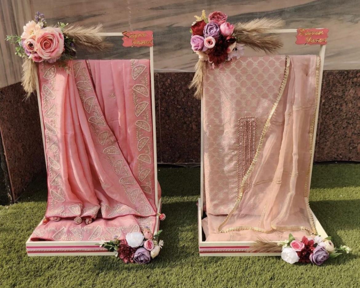 Elegant saree presentation with floral arrangements